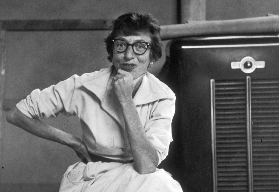 August 1953: Portrait of Abstract Expressionist artist Lee Krasner (1908 - 1984), wearing eyeglasses and seated next to a heater at her home in East Hampton, New York. (Photo by Tony Vaccaro/Hulton Archive/Getty Images)